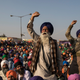 Farmers shout slogans as they participate in a protest at the Delhi Singhu border on December 18, 2020 in Delhi, India.